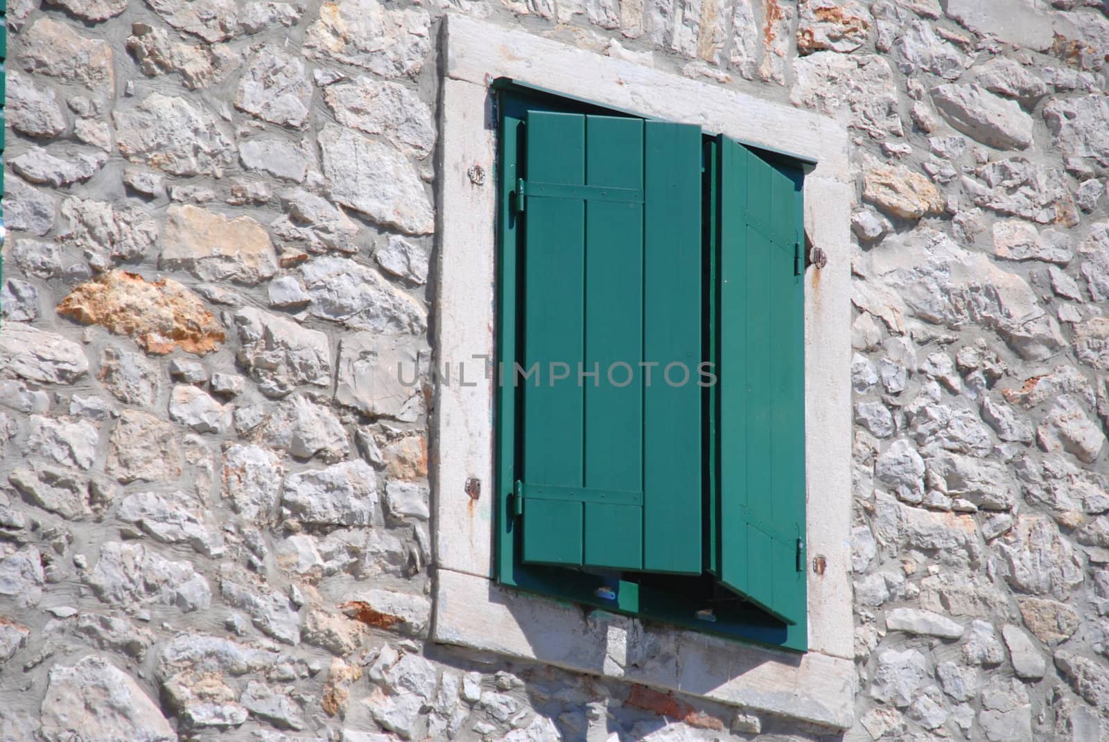 Closed green shutter in the window. Croatia, Vodice. by wojciechkozlowski