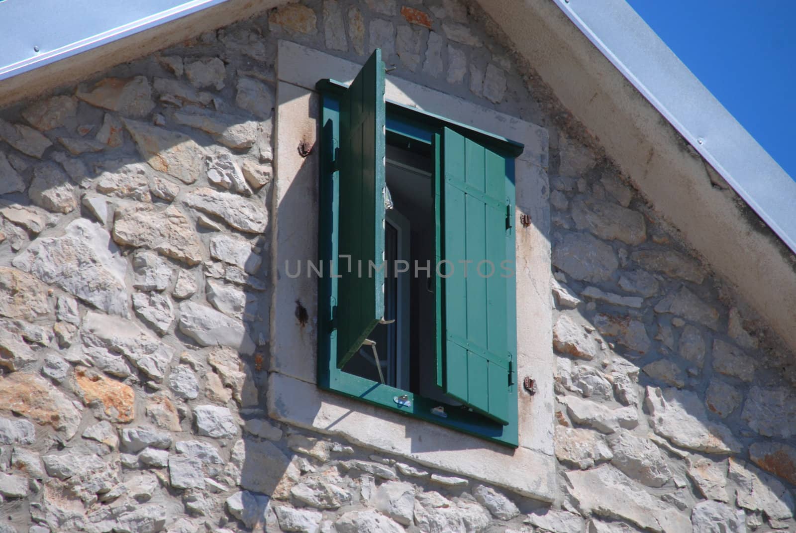 The open green shutter in the window. Croatia, Vodice.