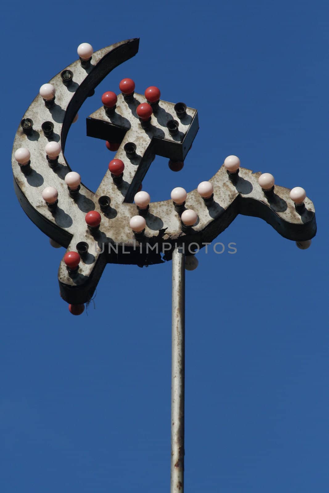 SICKLE AND HAMMER With a garland of electric lamps