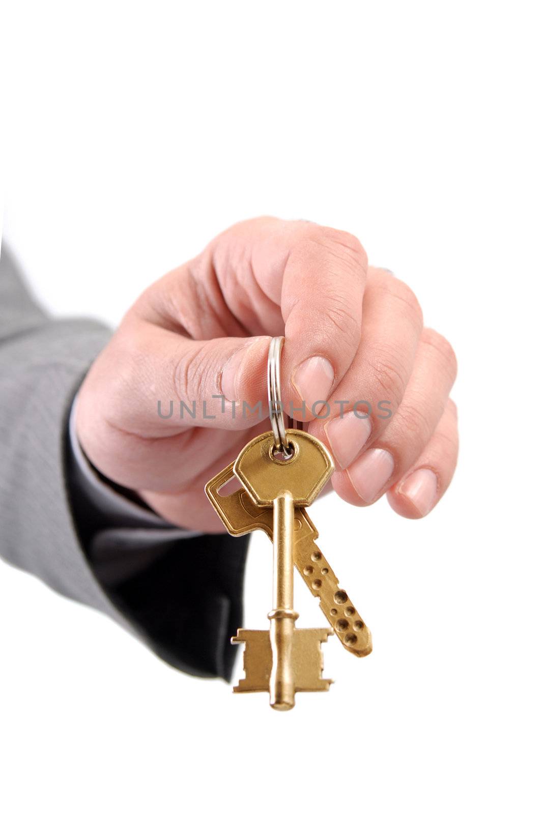 Male real estate executive hand holding two keys. by cienpies