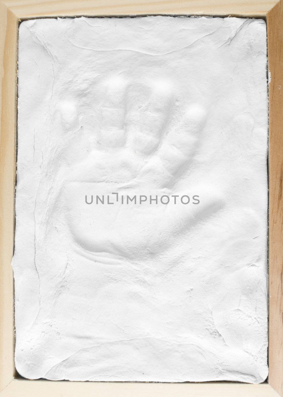 Small child memory handprint on clay in wooden frame