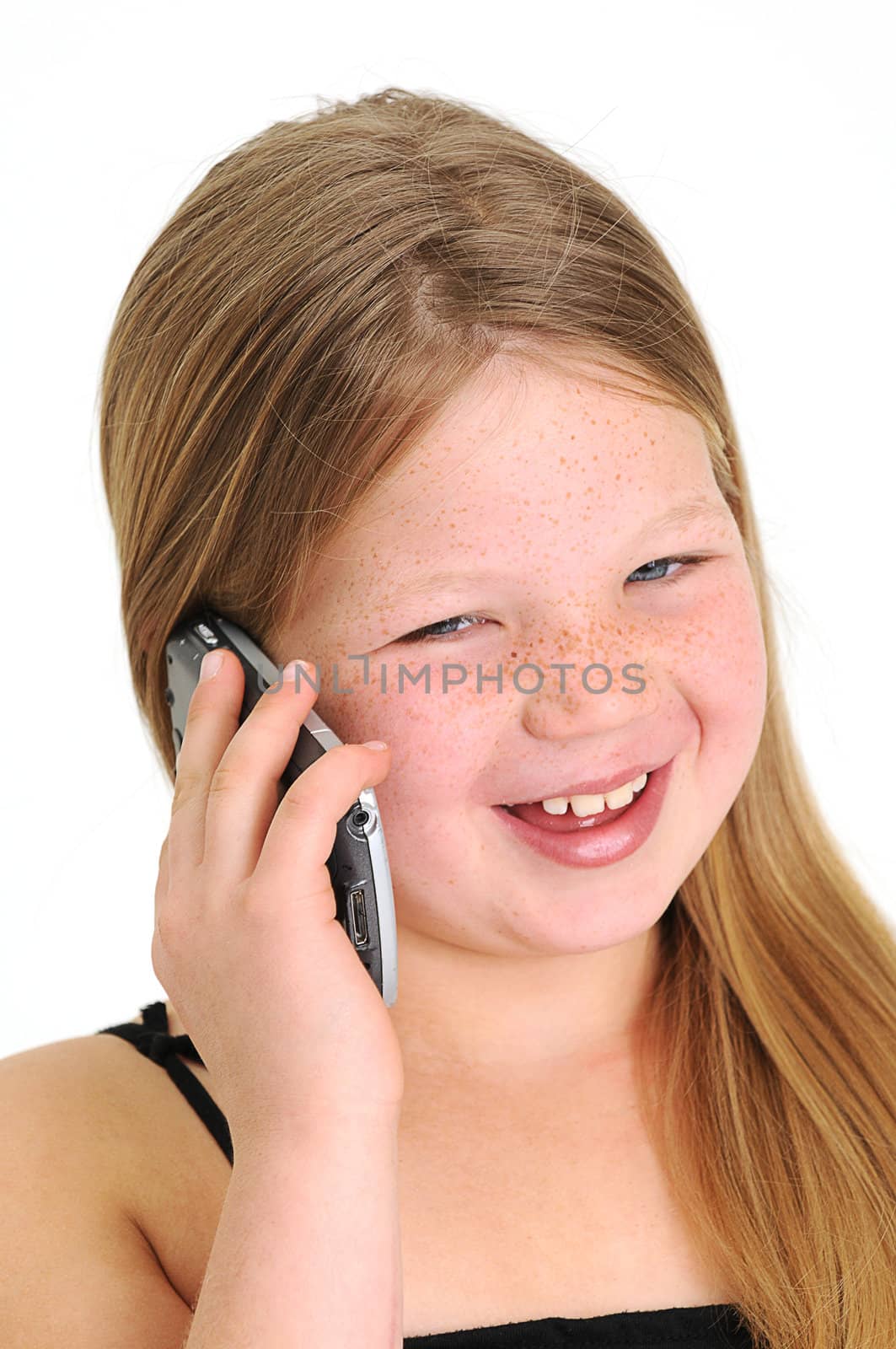 beautiful blond girl talking on a mobile phone and smiling