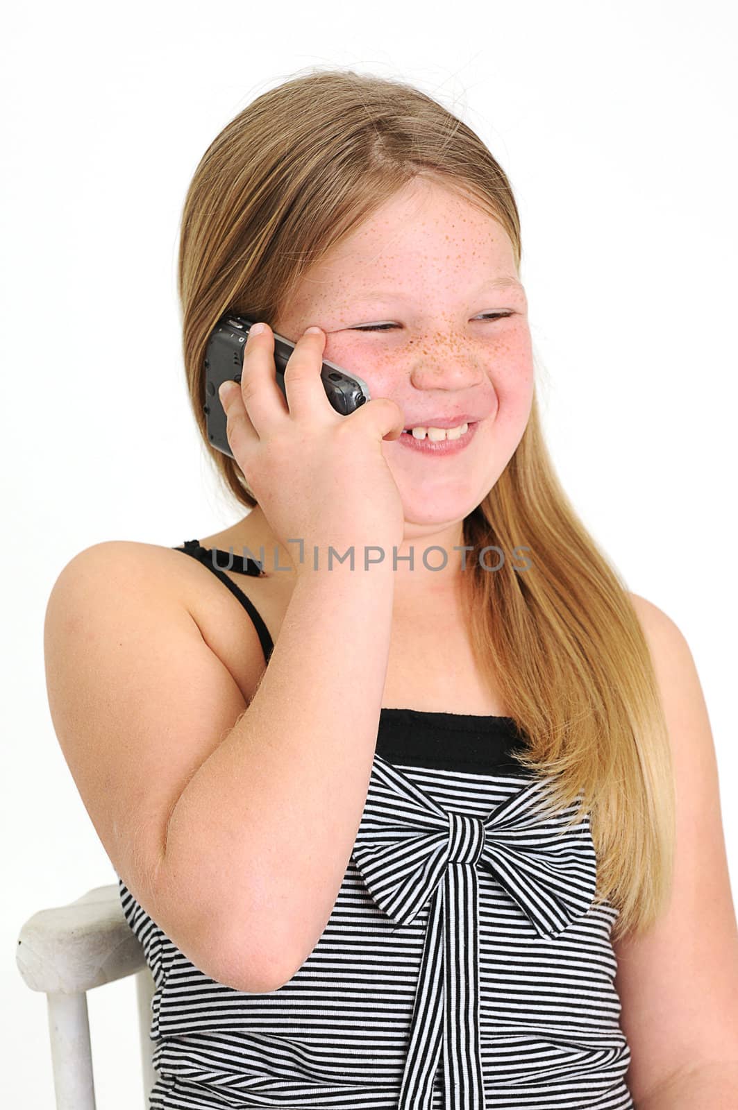 beautifull blond girl talking on a mobile phone by Ansunette