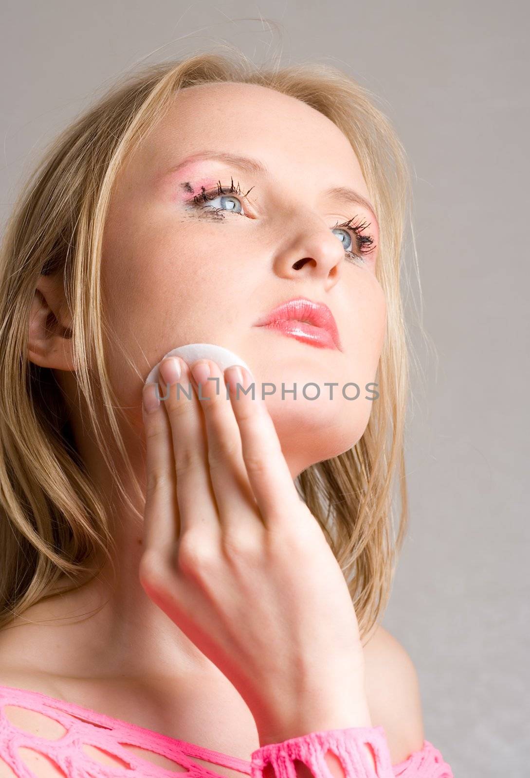 middle age woman applying face pack