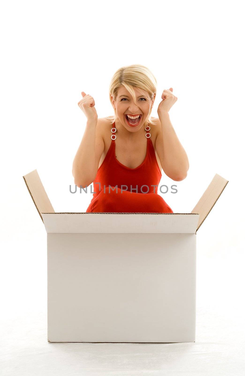 Happy girl in red dress with big blank white box