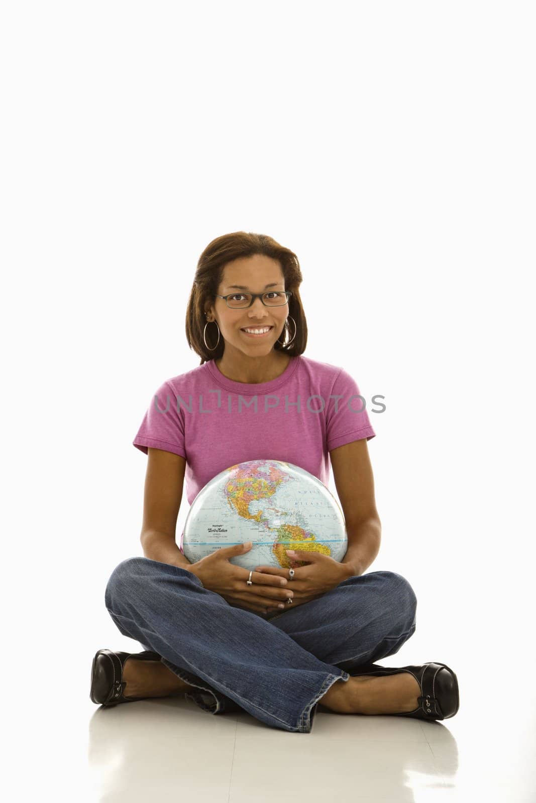 Woman holding globe. by iofoto