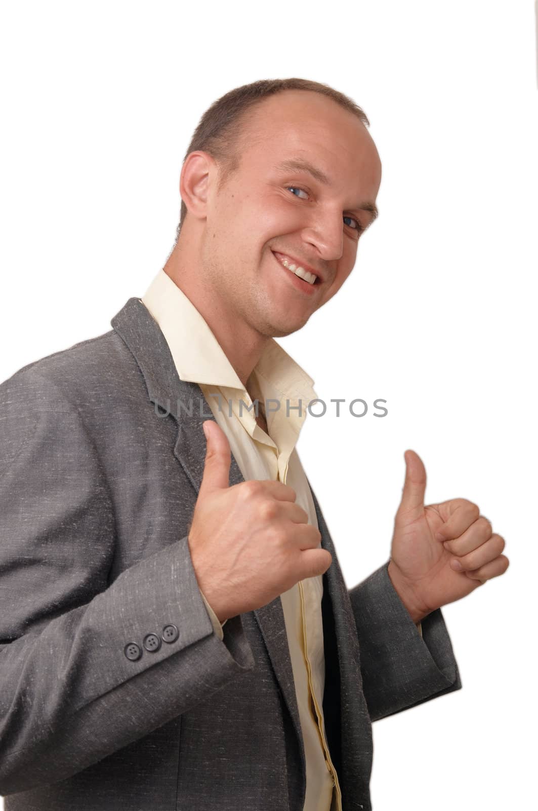 A smiling  young man showing of hands making shape like guns .