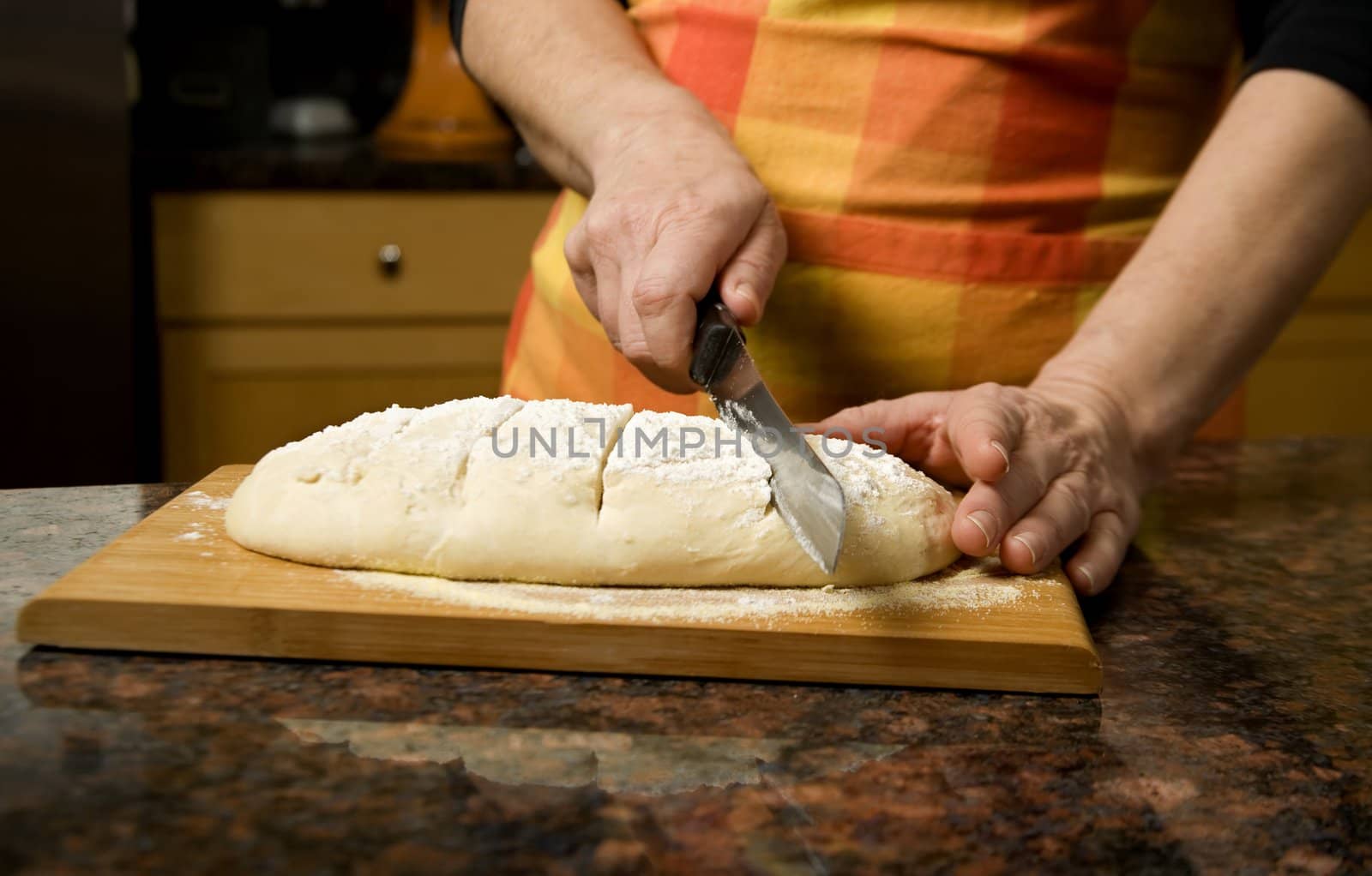 Adding cut to unbaked bread dough by Creatista