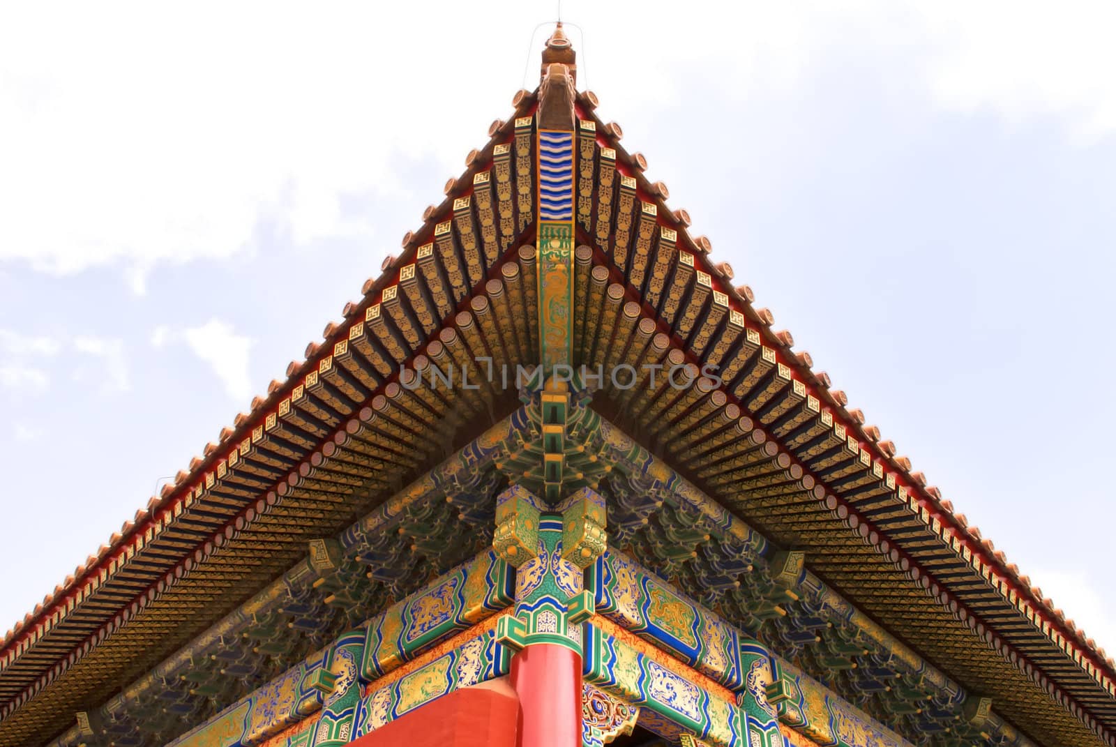 Beijing Forbidden City: view of the corner of a roof. by Claudine