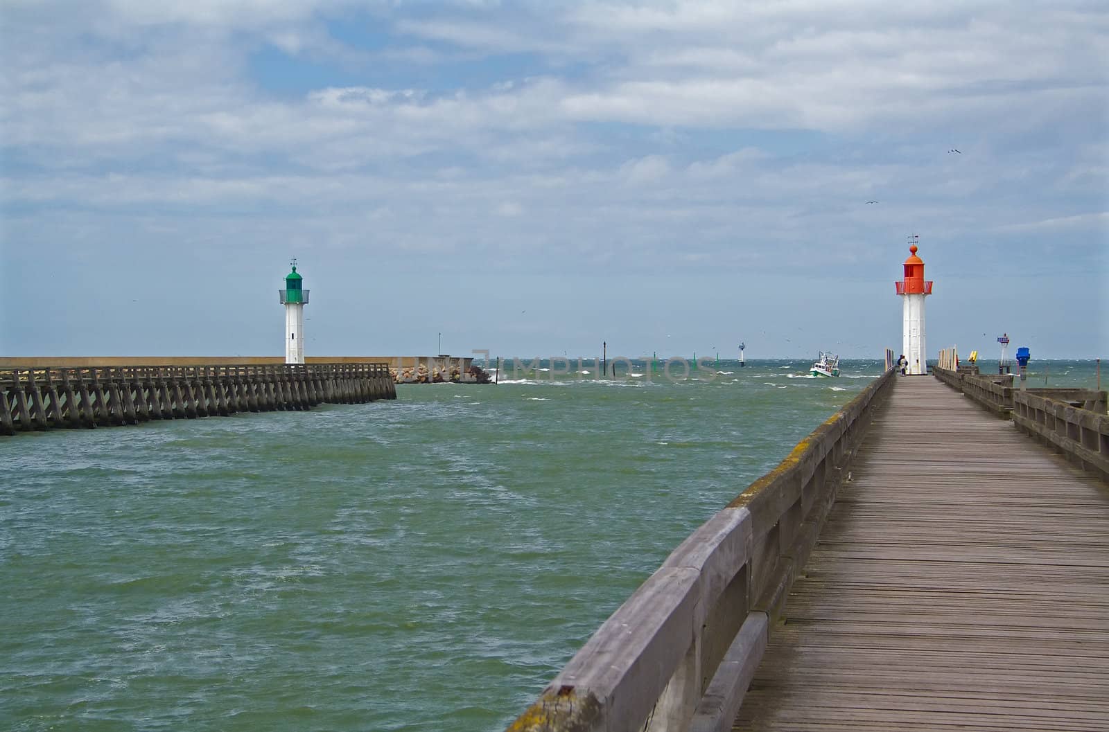 Two decks and lighthouses marking the entrance of the Trouville port, Normandy, France
