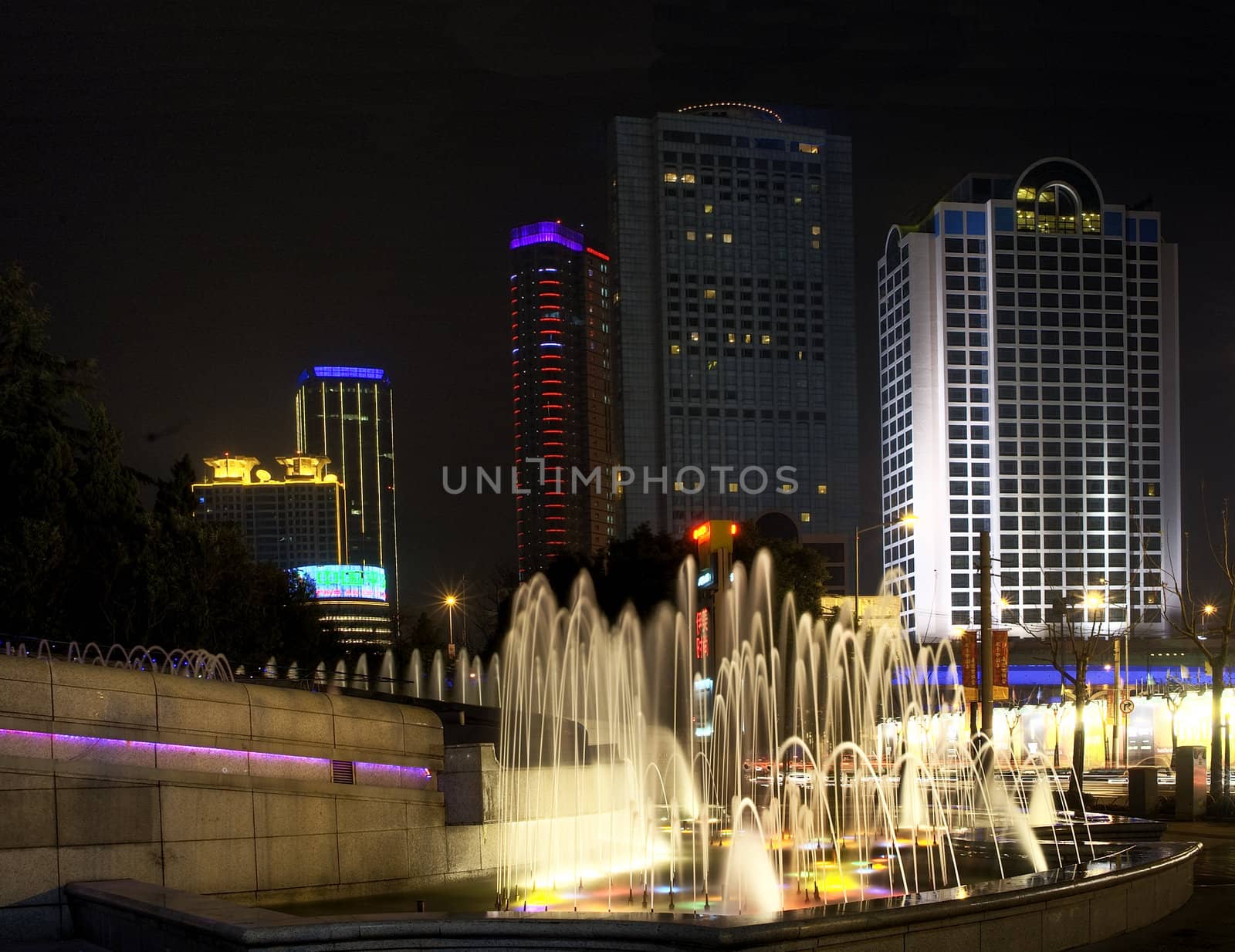 shanghai fountainilluminated by colorfull light by night