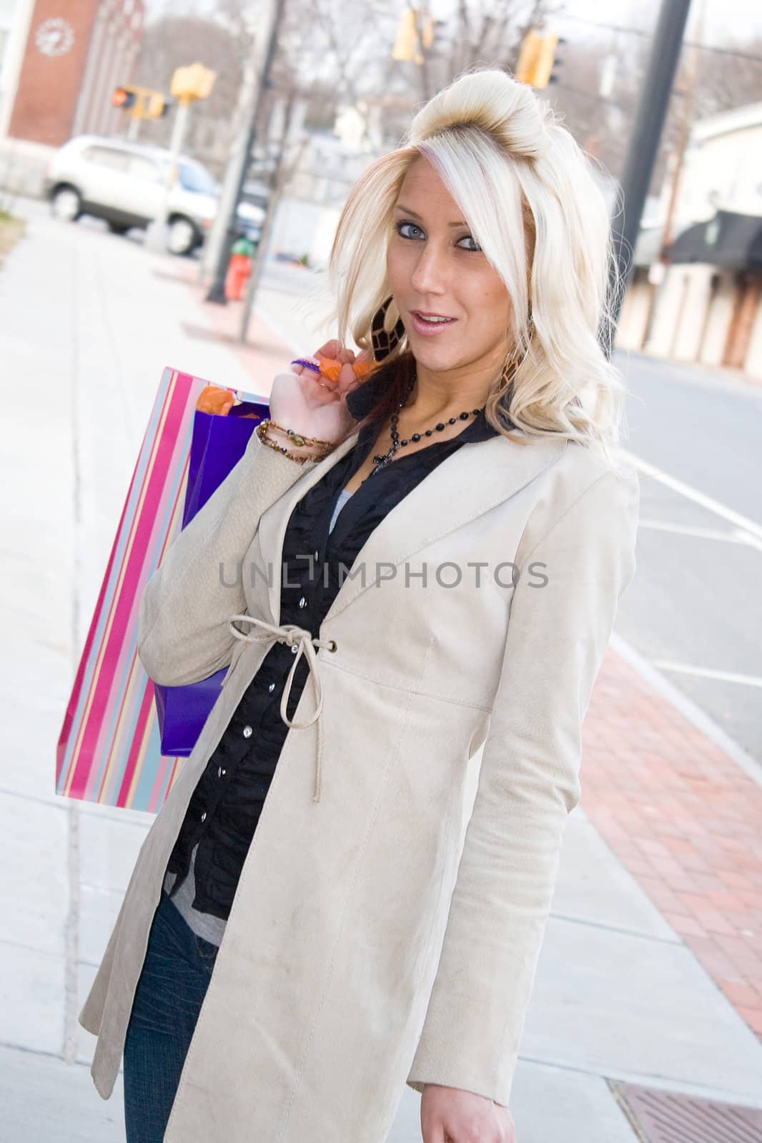 An attractive girl out shopping in the city.