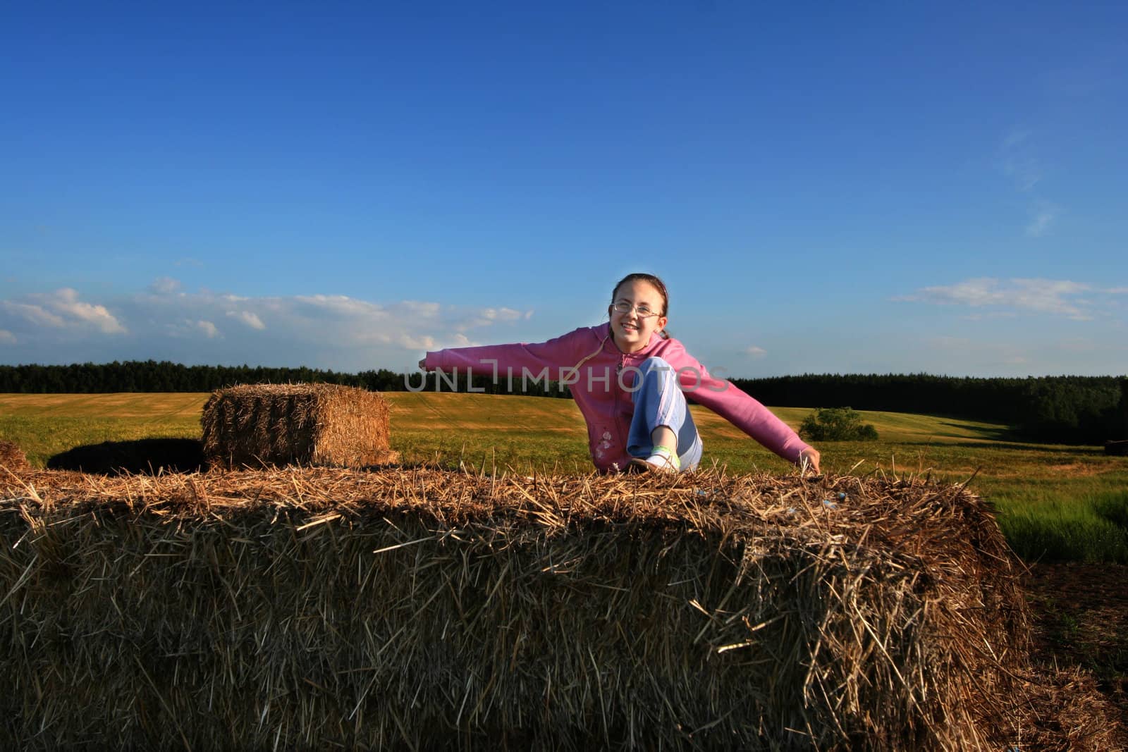 Girl having fun in grain field