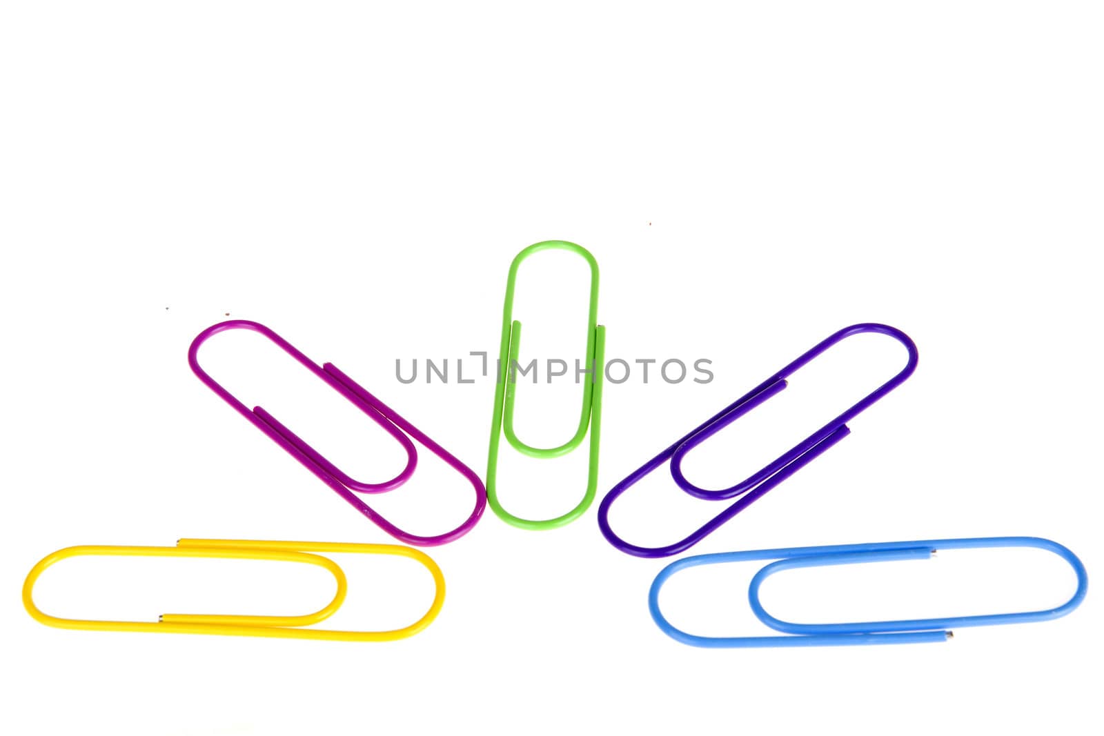 five colorful paperclips on a white background