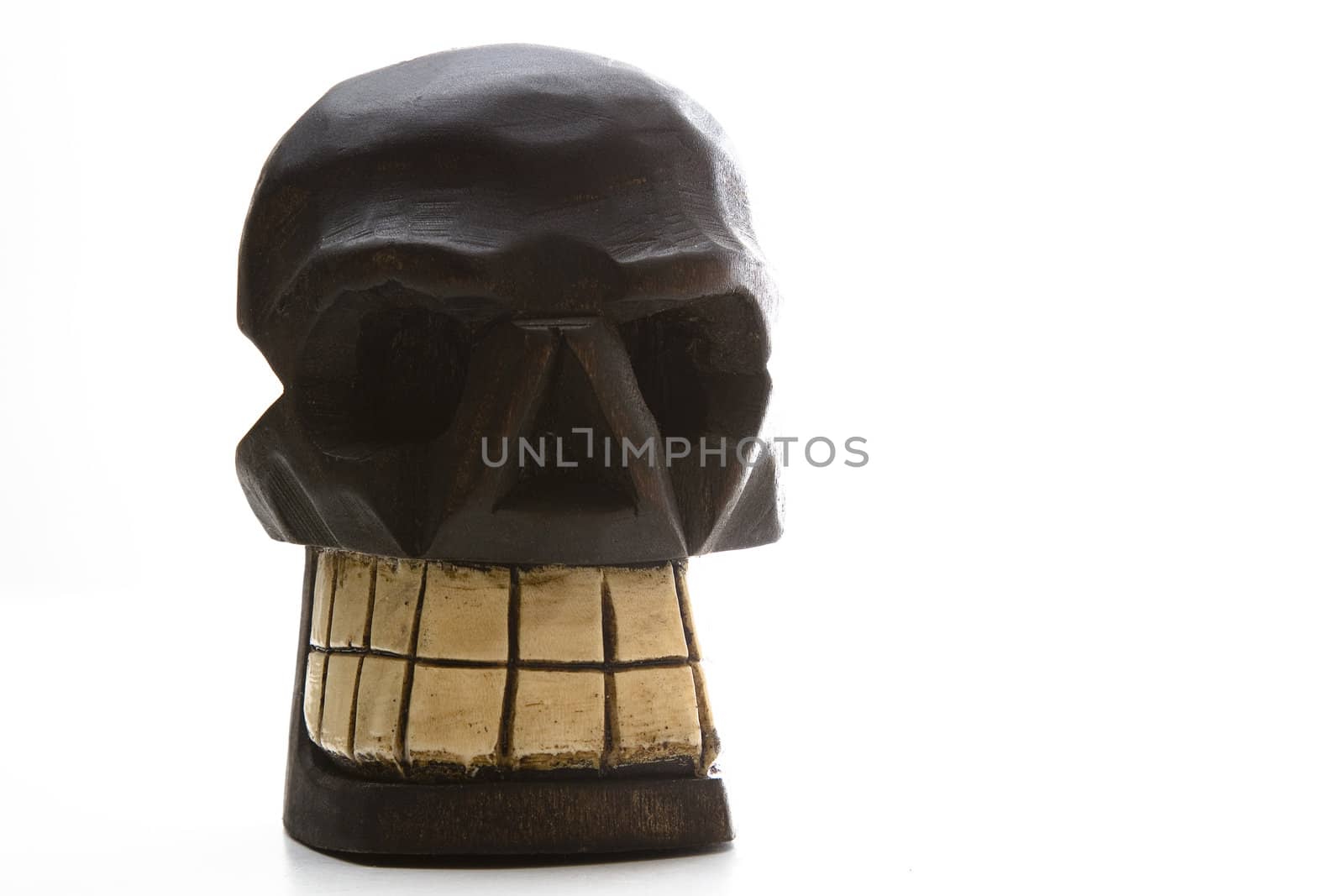 Mexican Dia de los muertos skull sculpture in wood