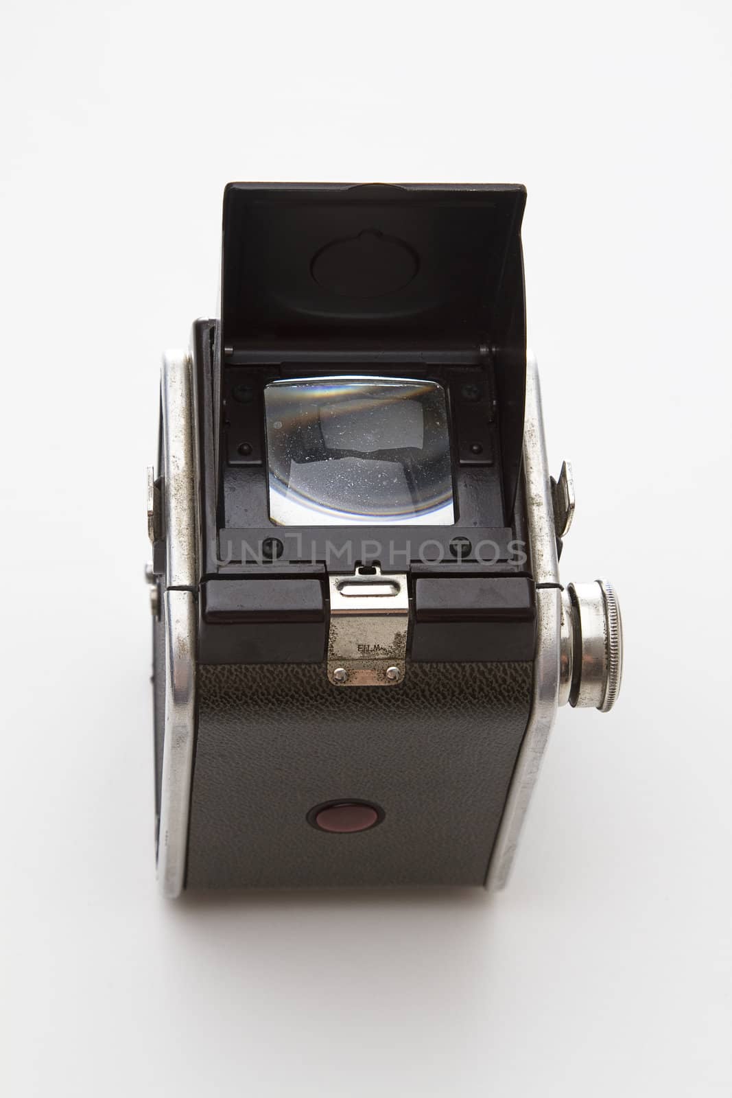Old medium format from the 50's use by amateur photographer with viewer door open viewed from behind