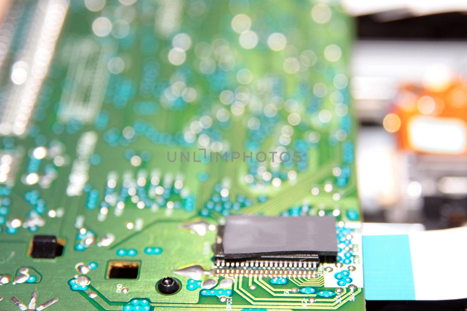 close up of a green and blue printed circuit board