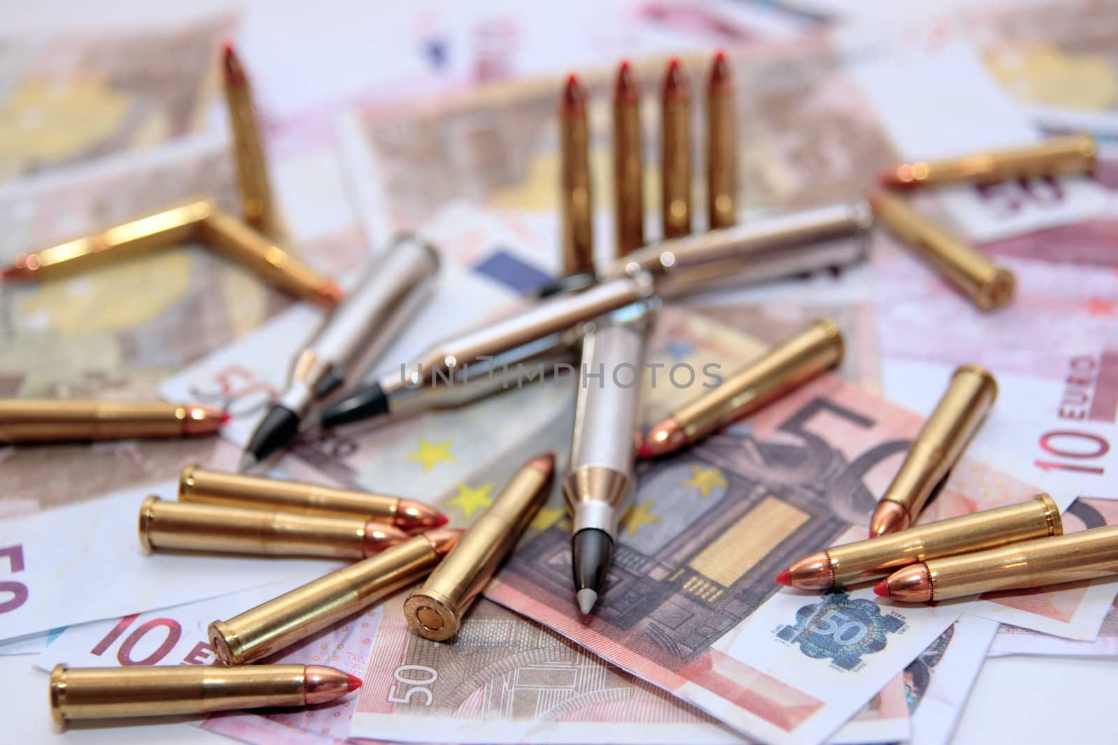bullets and money showing a dangerous side to life