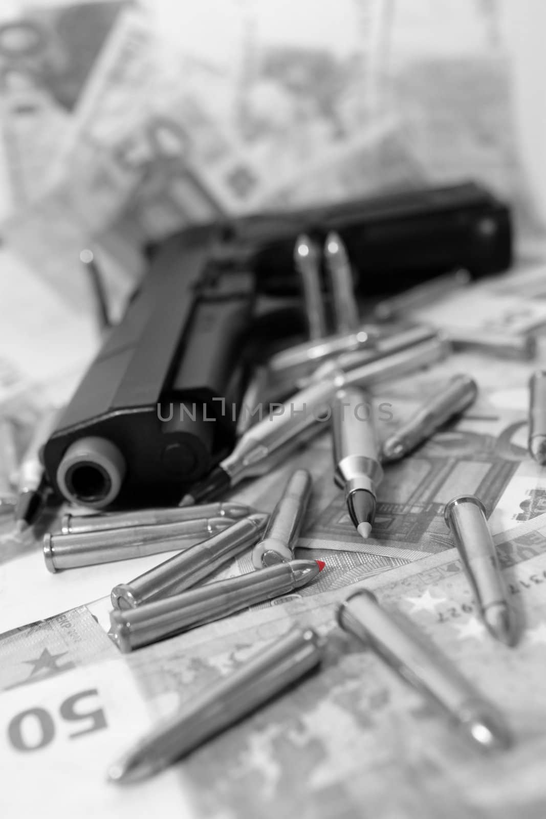 gun bullets and money showing a dangerous side to life