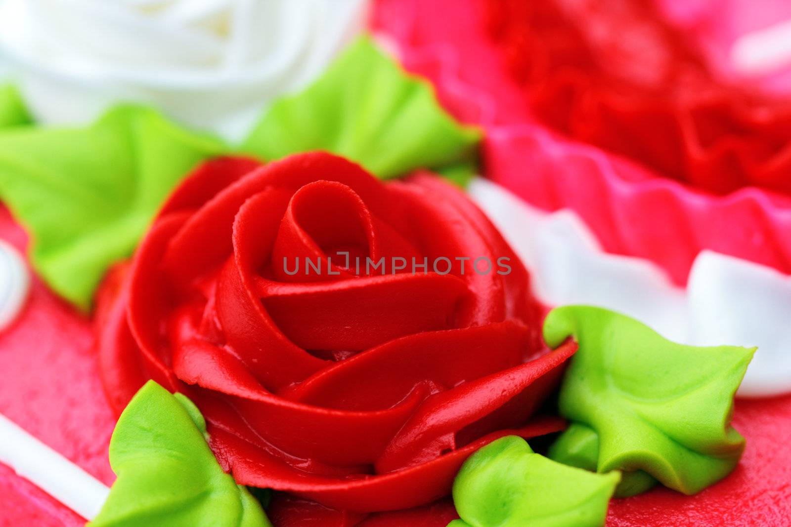 Up-close rose shaped cake icing for birthday, anniversary or Valentine's Day.