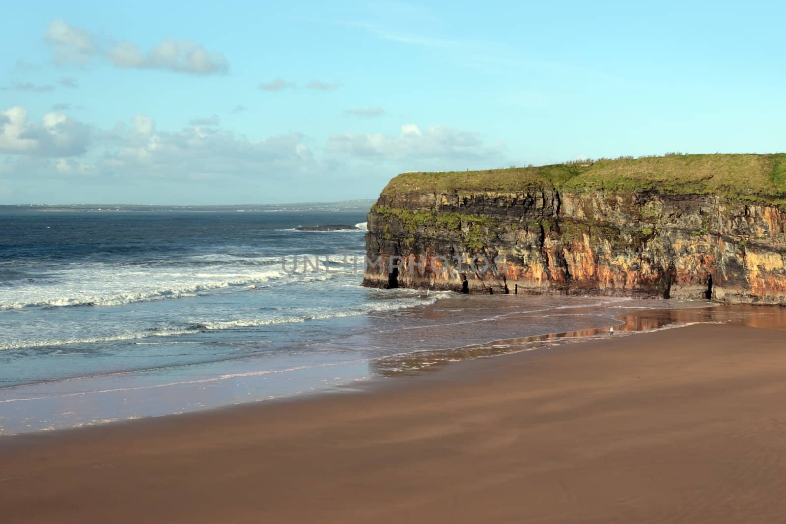 the waves crashing in on ballybunion beach ireland