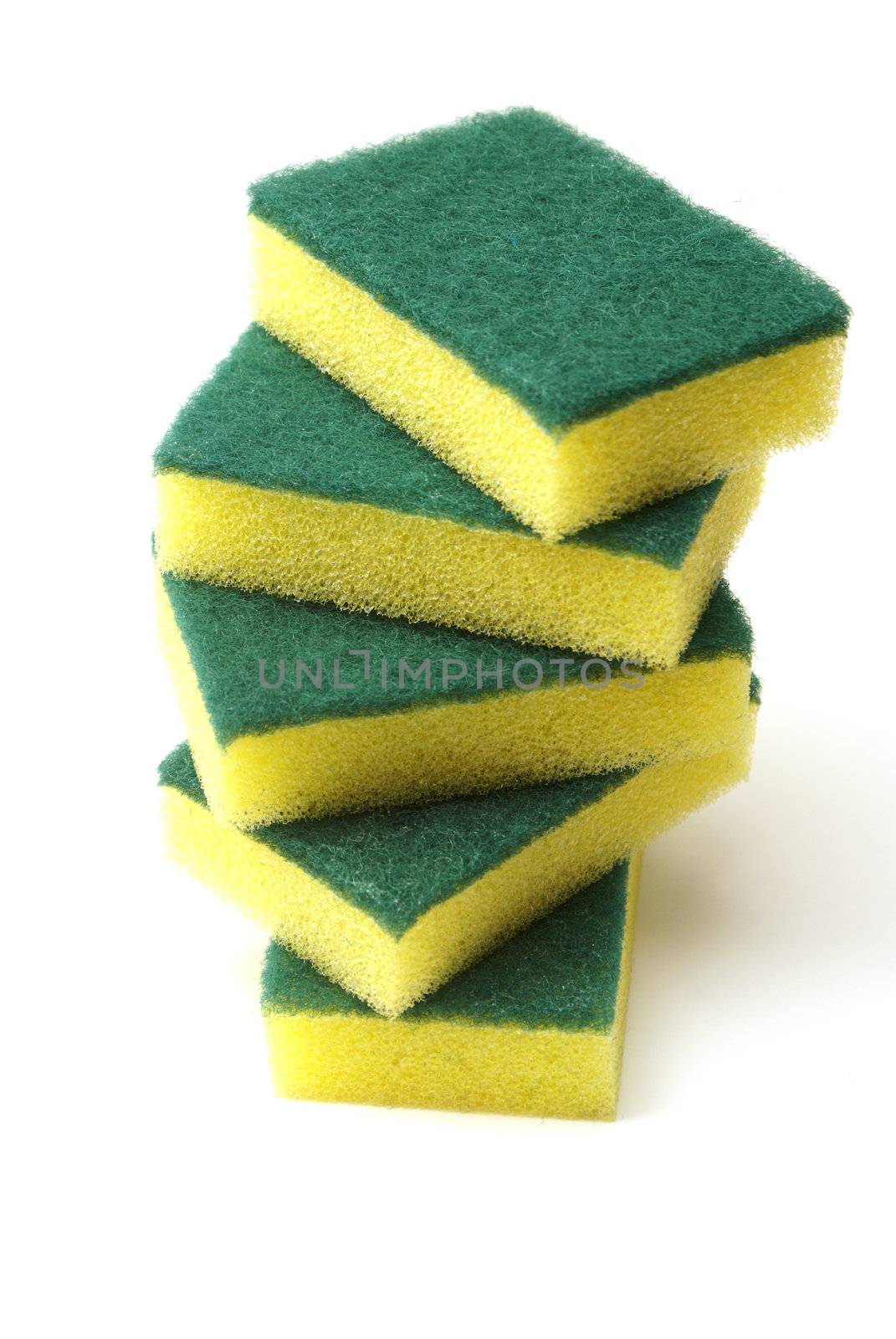 A stack of cleaning sponges with two scrubbing sides.