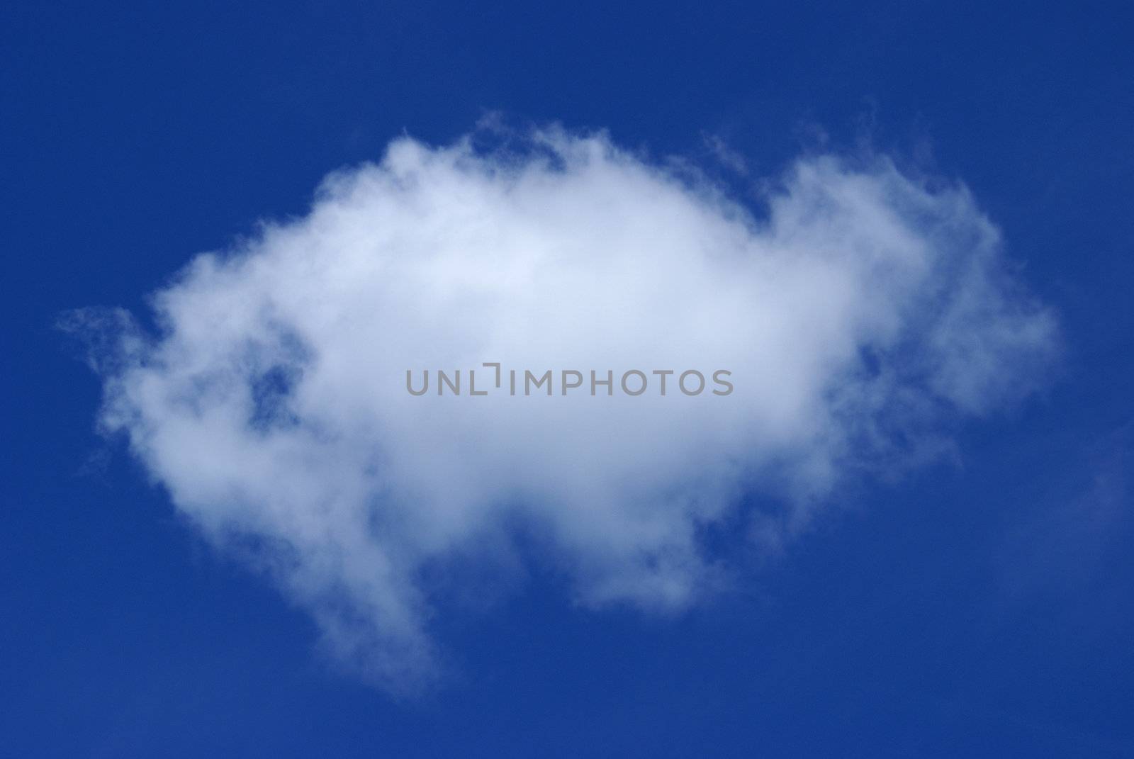 A single cloud in a sky of bright blue.