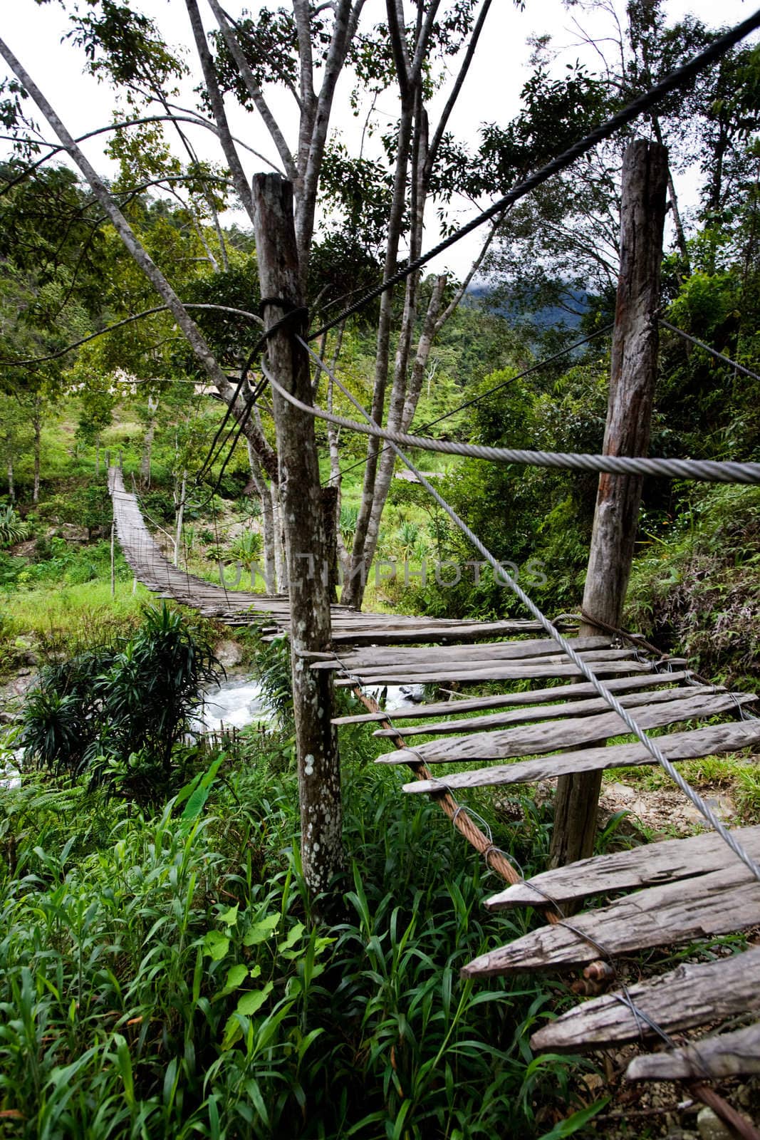 An old hanging bridge over a river