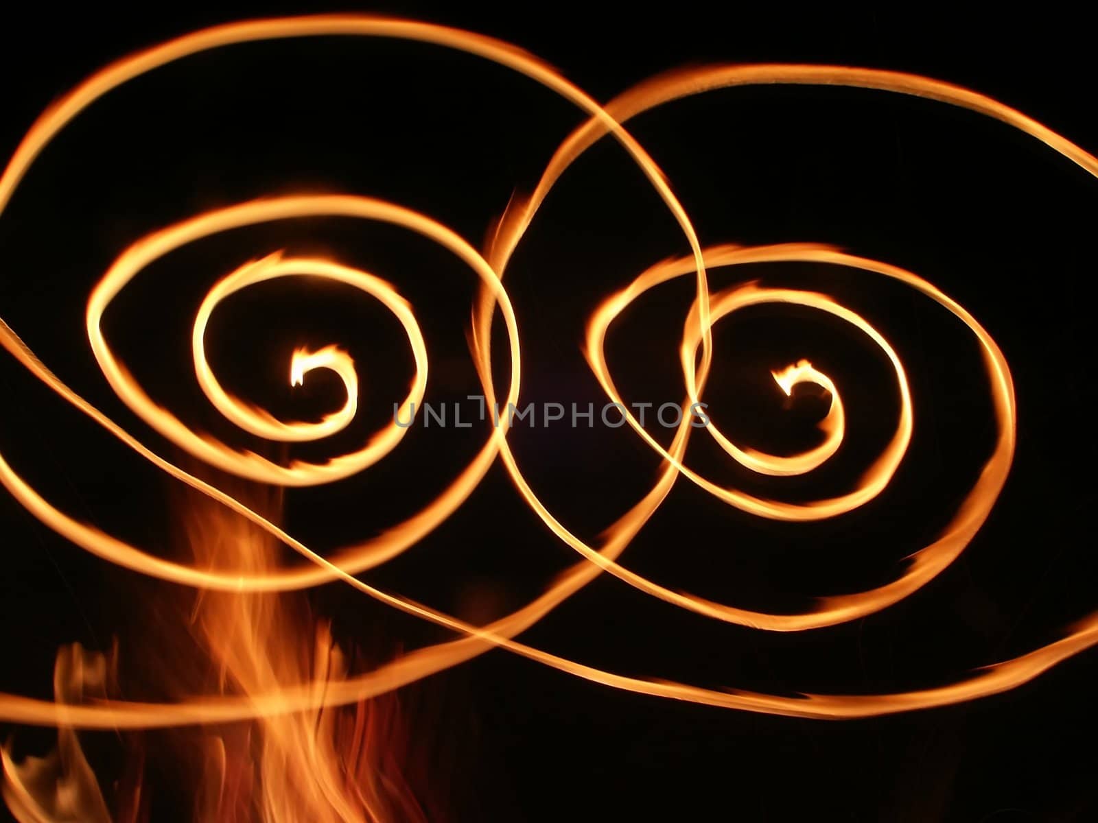 Bright swirls of flame light up the night.