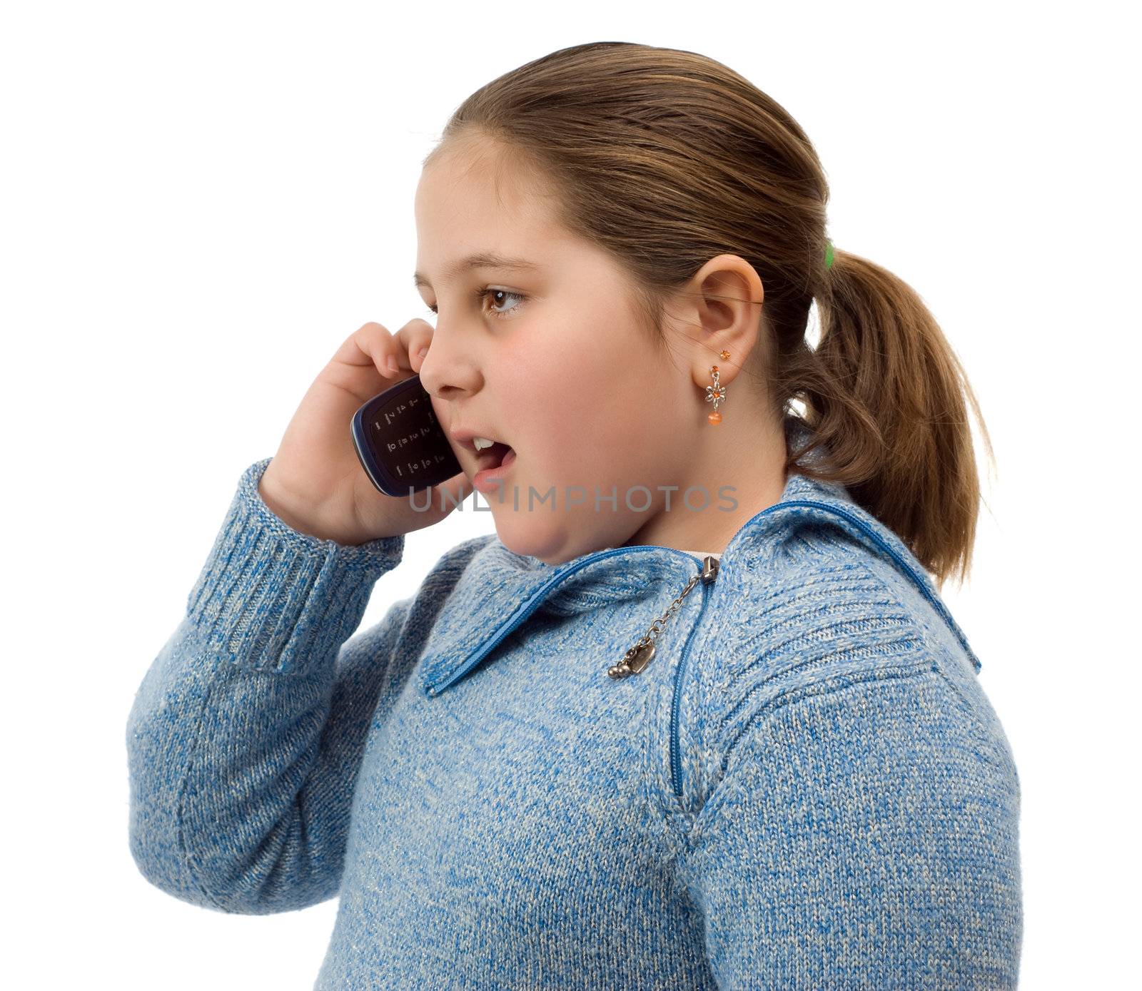 A young girl talking on a cell phone, isolated against a white background