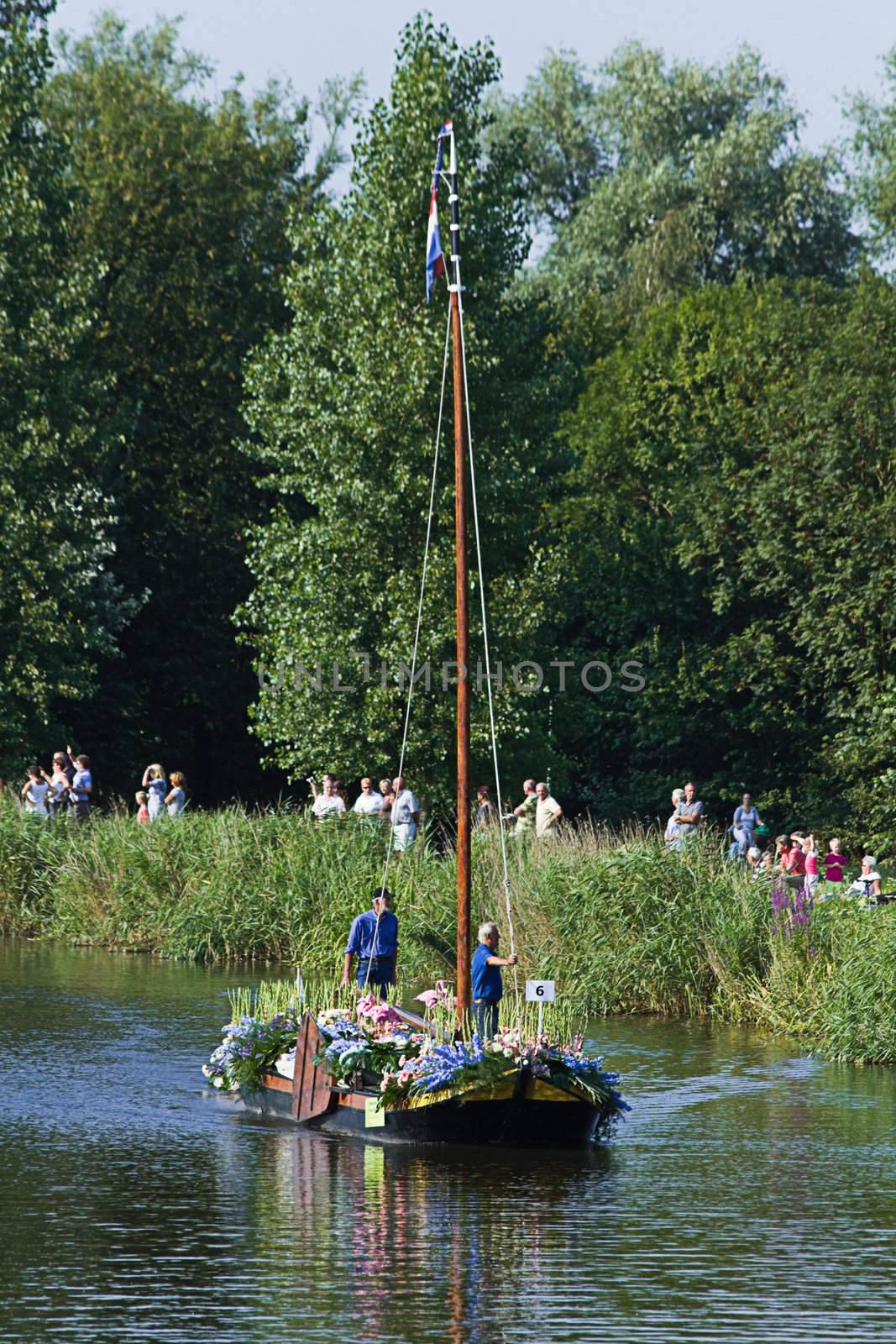 VLAARDINGEN, THE NETHERLANDS - JULI 2010: Beautiful flower boats in the unique annual Westland Floating Parade Juli 30, 2010, Vlaardingen, the Netherlands.

