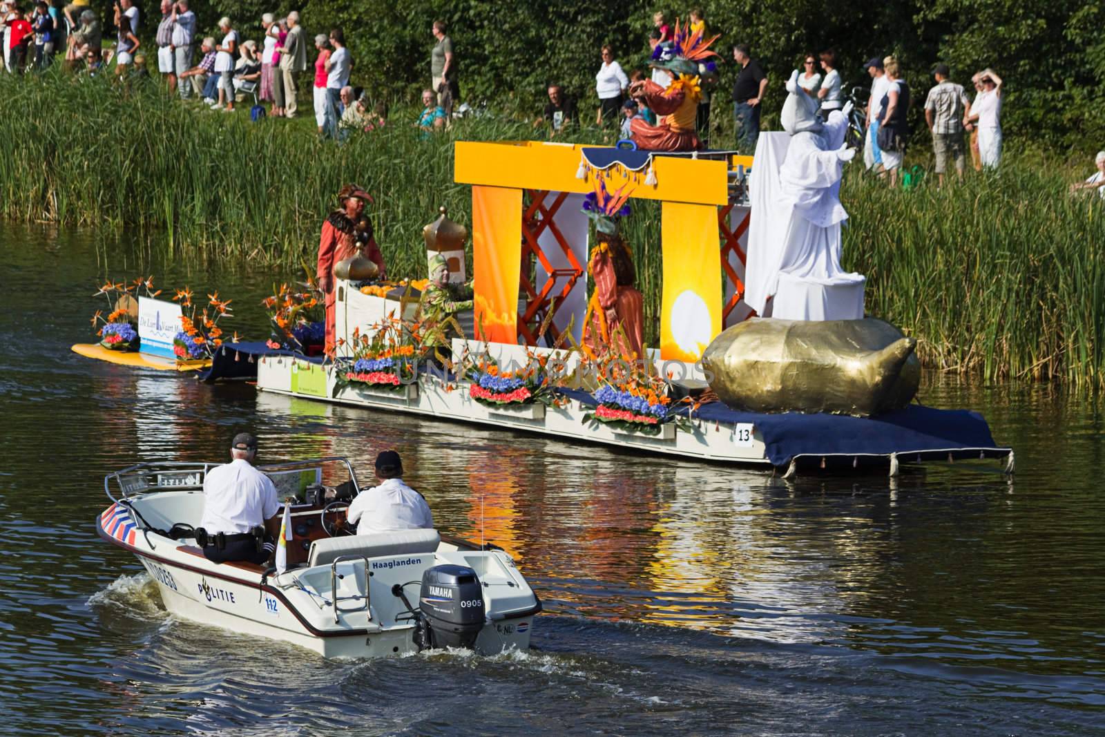 VLAARDINGEN, THE NETHERLANDS - JULI 2010: Beautiful flower boats in the unique annual Westland Floating Parade Juli 30, 2010, Vlaardingen, the Netherlands.

