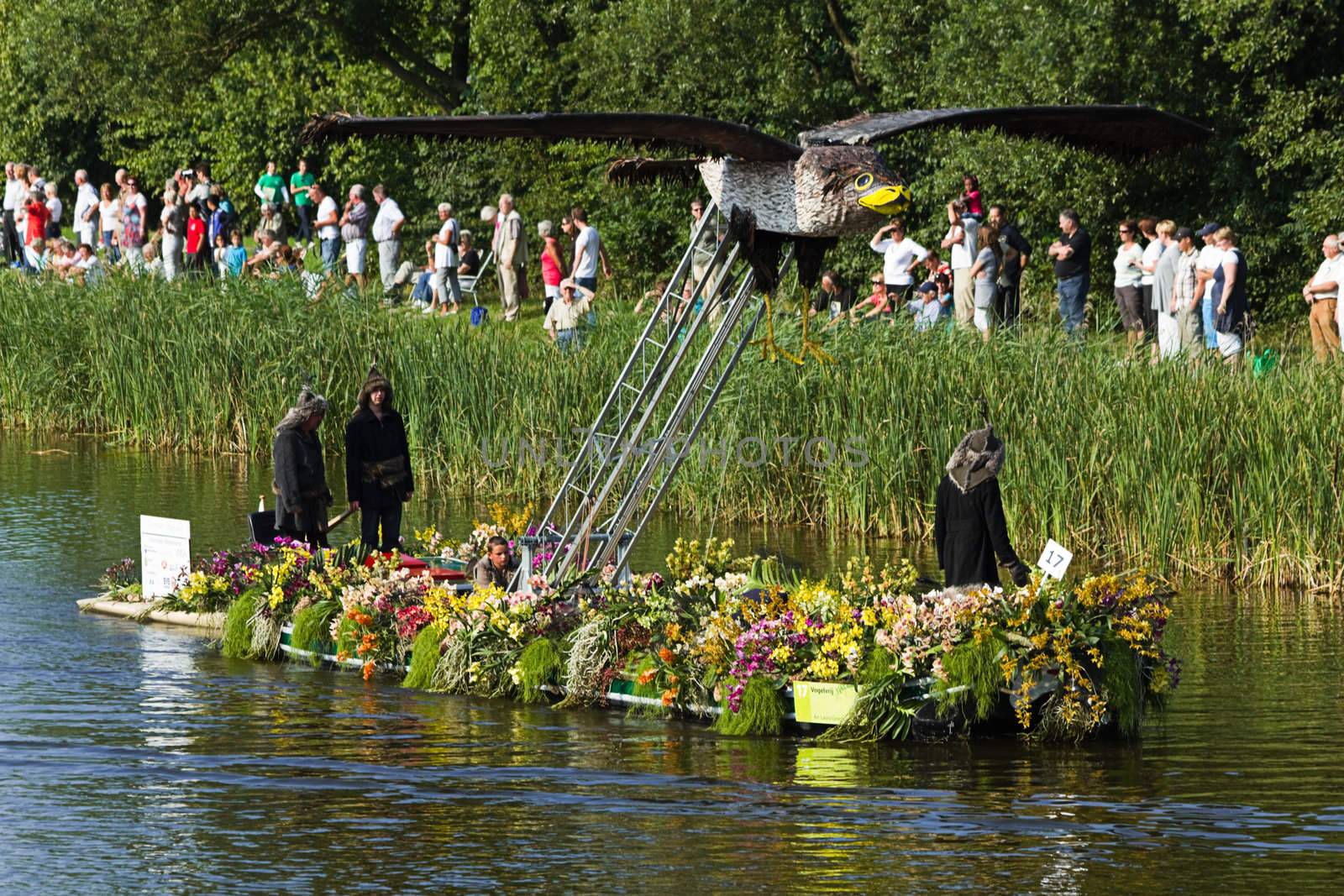 VLAARDINGEN, THE NETHERLANDS - JULI 2010: Beautiful flower boats in the unique annual Westland Floating Parade Juli 30, 2010, Vlaardingen, the Netherlands.


