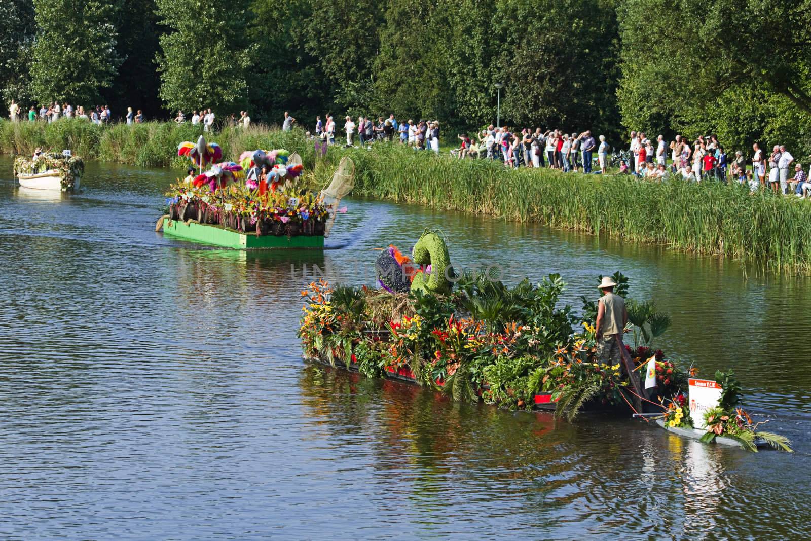 VLAARDINGEN, THE NETHERLANDS - JULI 2010: Beautiful flower boats in the unique annual Westland Floating Parade Juli 30, 2010, Vlaardingen, the Netherlands.


