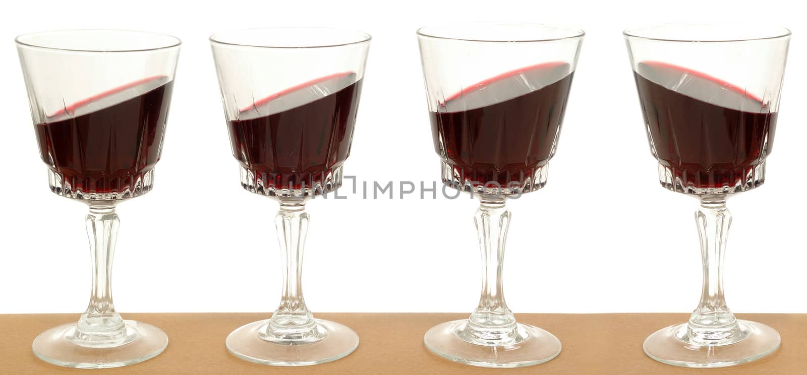 Wineglasses on a line by cfoto