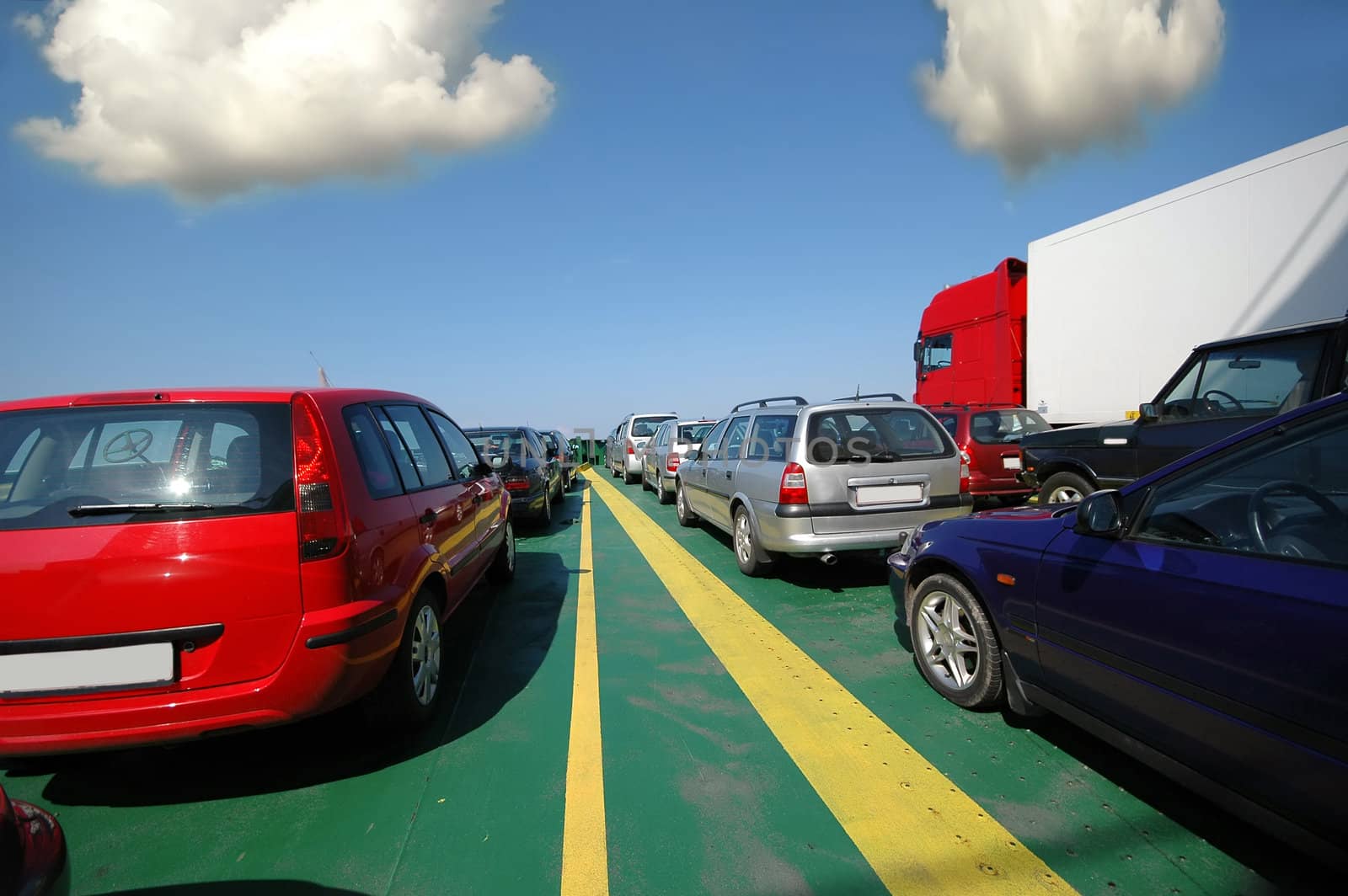 Cars holding in lines waiting on ferry