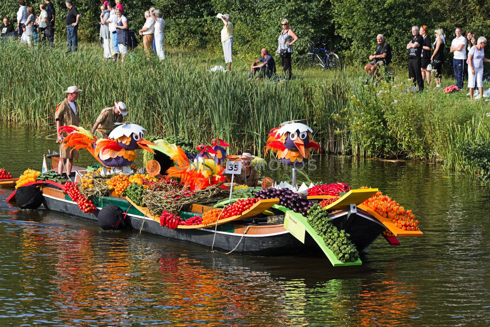 VLAARDINGEN, THE NETHERLANDS - JULI 2010: Beautiful flower boats in the unique annual Westland Floating Parade Juli 30, 2010, Vlaardingen, the Netherlands.

