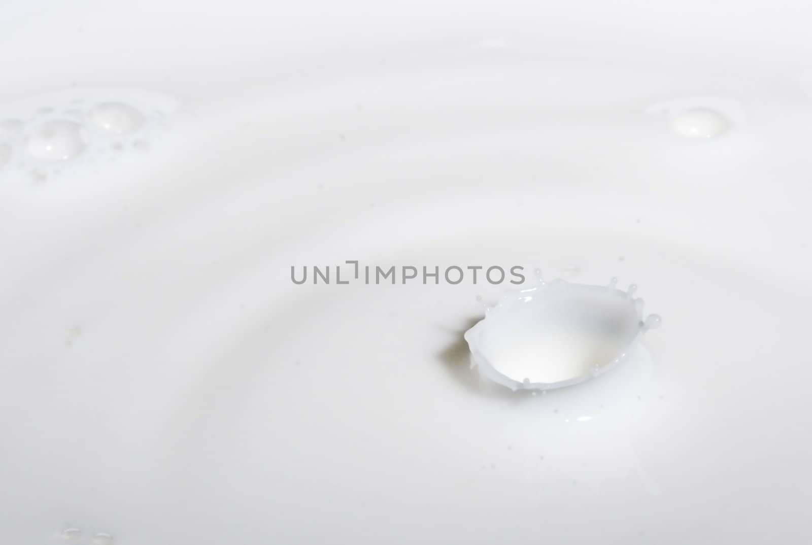 a drop splash of withe liquid or milk