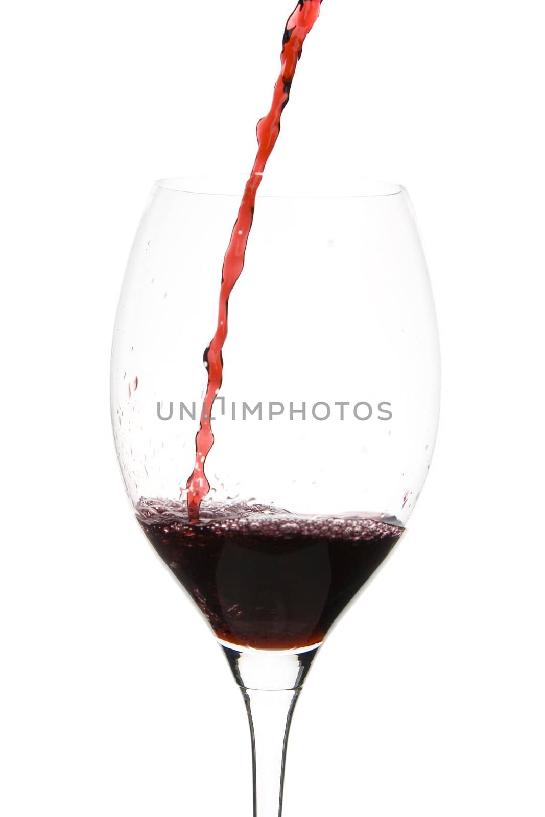 a clear glass of red wine isolated on white background