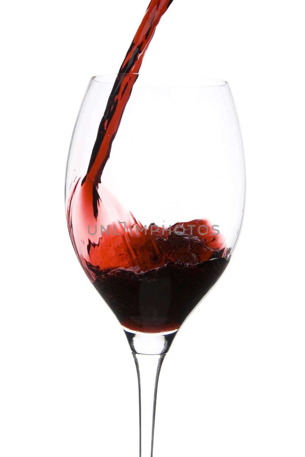 a clear glass of red wine isolated on white background