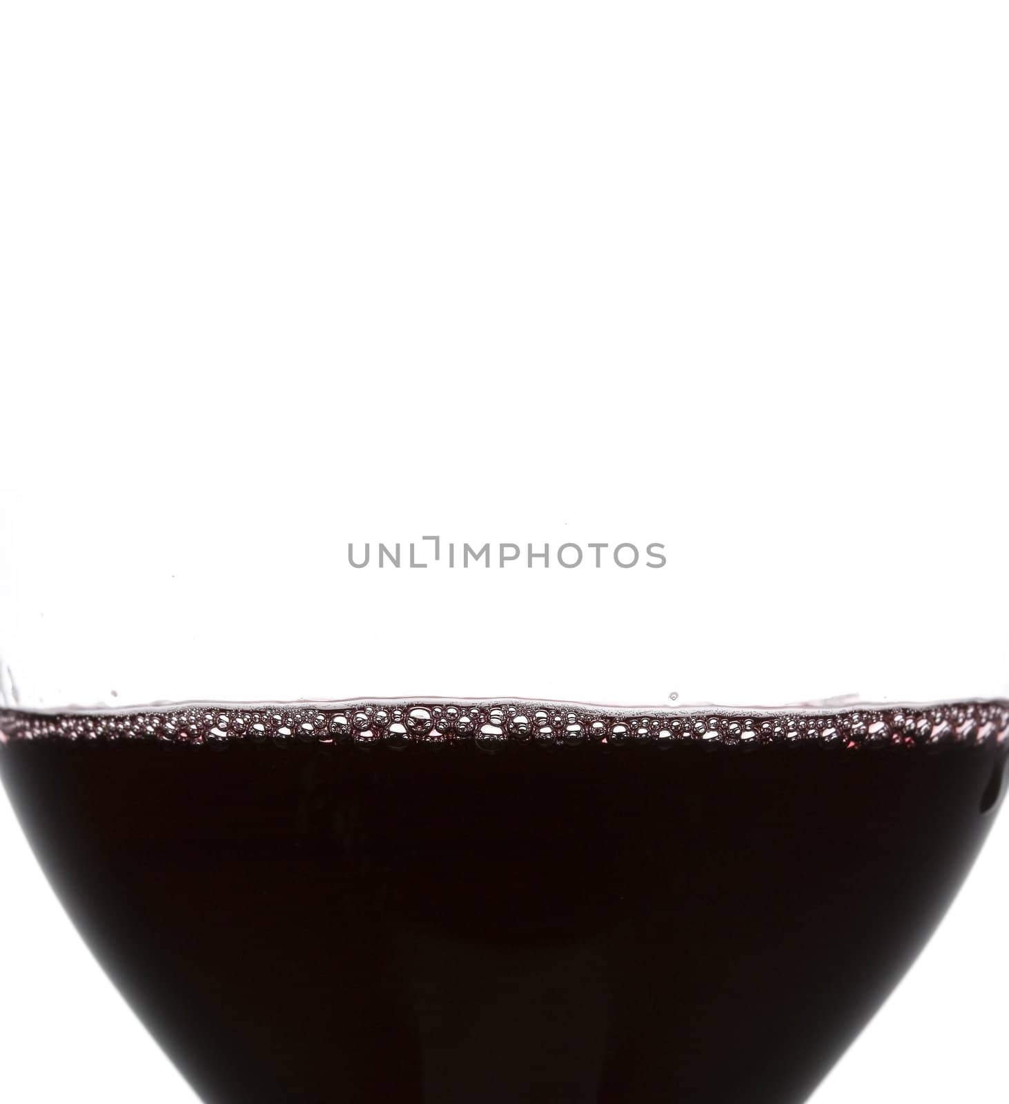 a clear glass of red wine isolated on white background