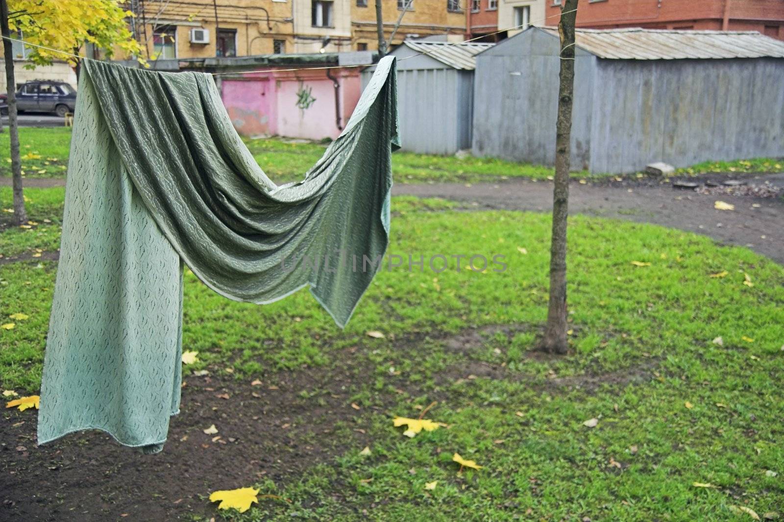 Curtain drying on string in backyard by simfan