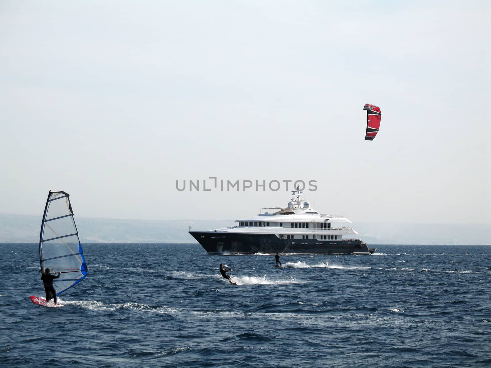 A windsurfing and kitesurfing on the sea by Michael_Feigin