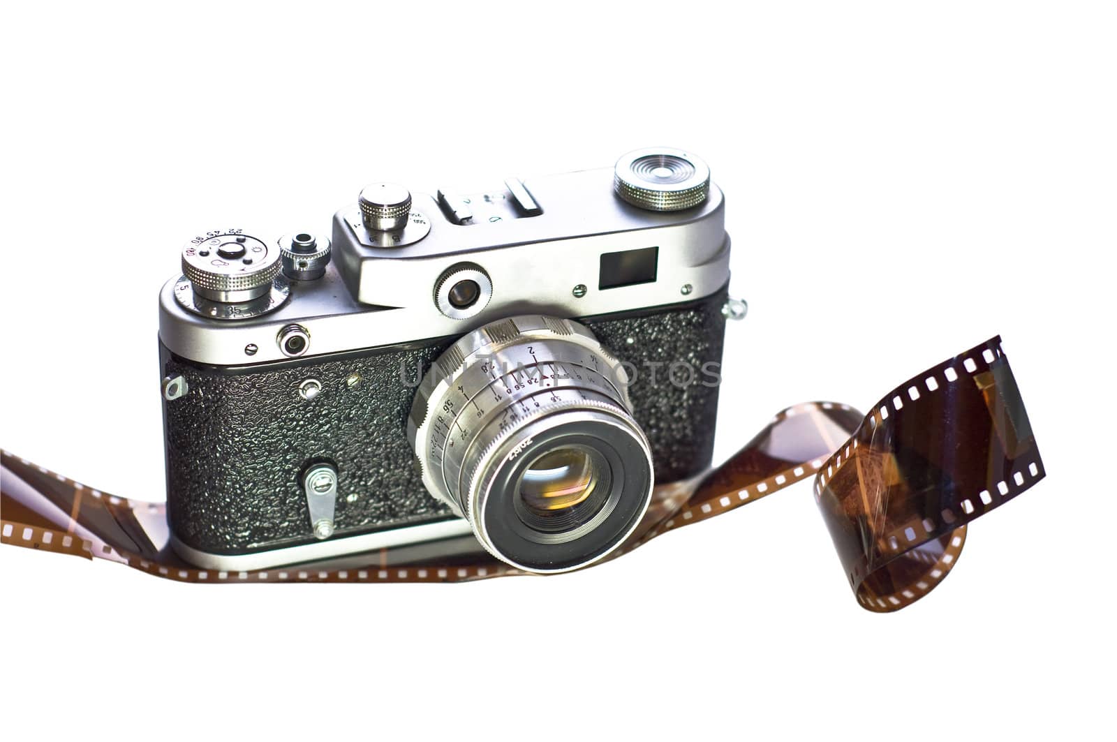 Retro film camera is shown on 35mm film. White background, isolation. Medium-format camera with interchangeable lenses.