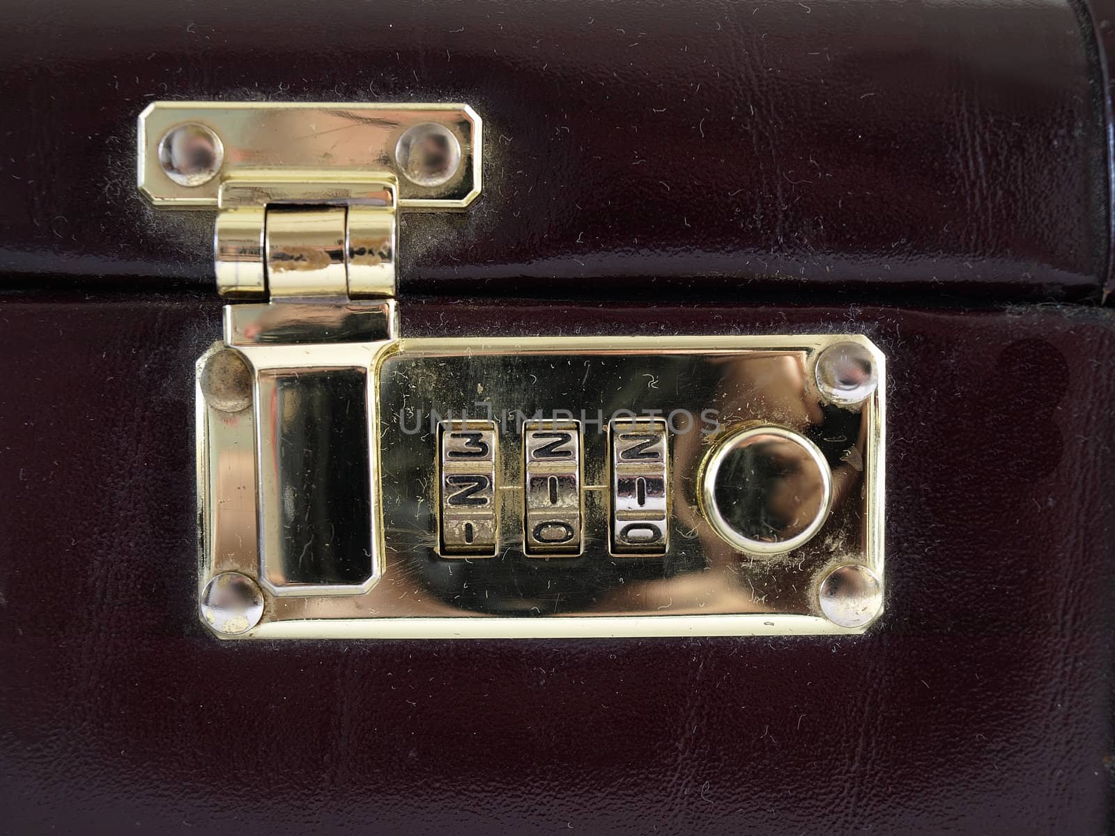 Isolated view of a combination lock in a closed and locked position