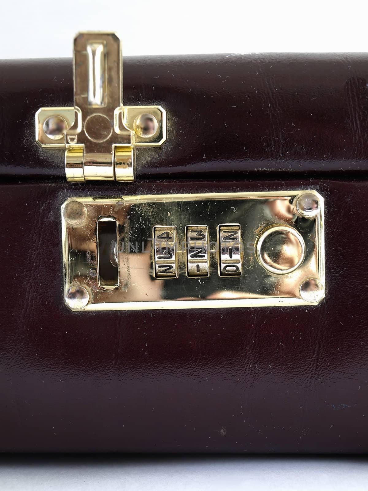 Isolated view of a combination lock in an open position