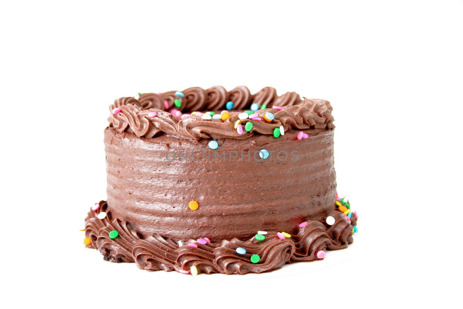 Chocolate cake with sprinkles isolated on white.