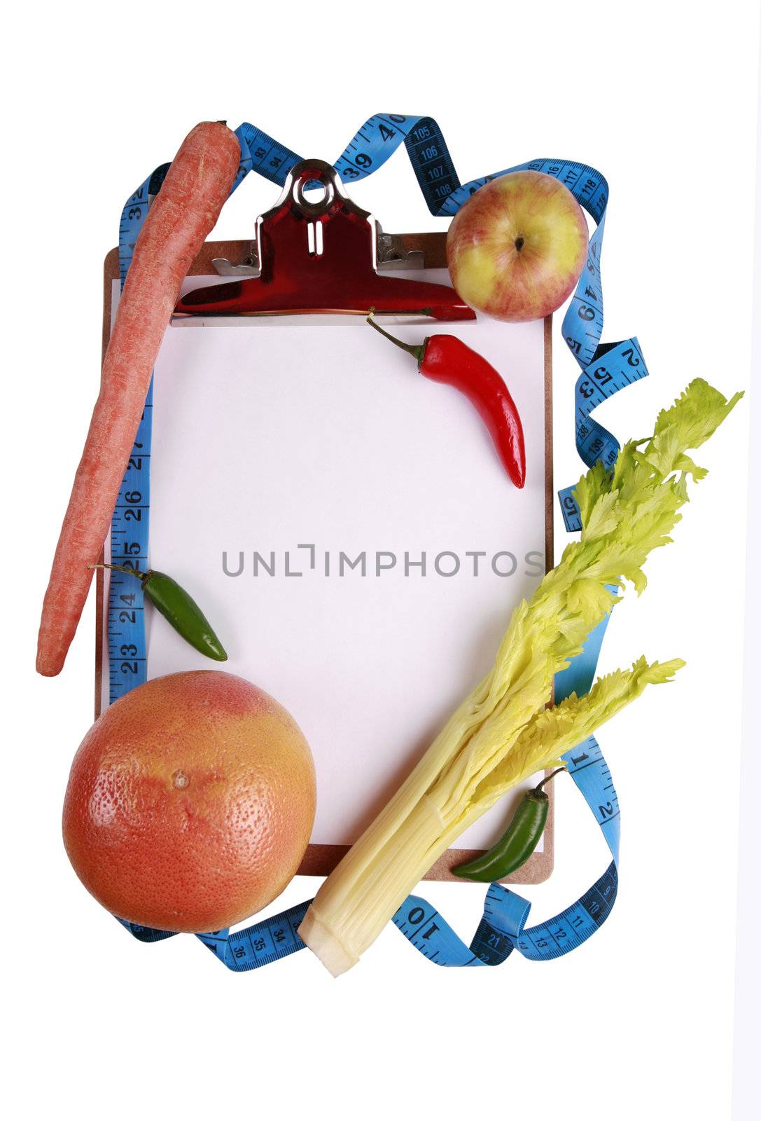 Healthy eating conceptwith fruits and vegetables surrounding clipboard. Tape measure and text space