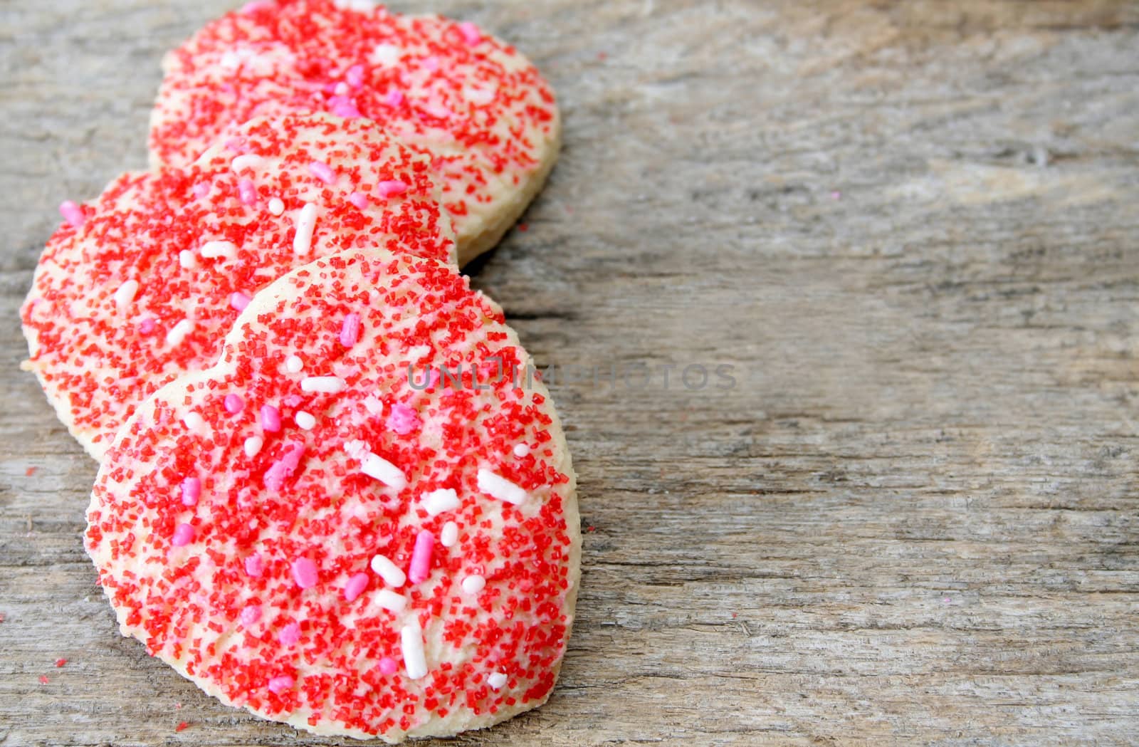 Heart shaped cookies with sprinkles.
