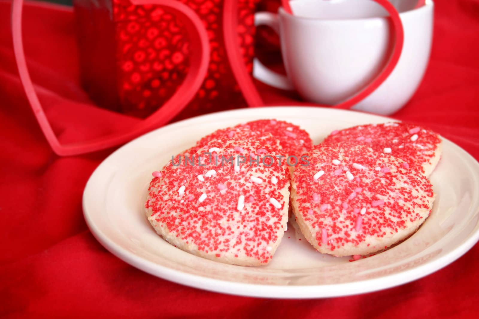 Valentine cookies on a white plate.